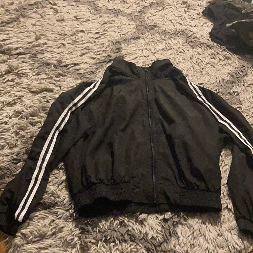 Black windbreaker with 2 white stripes on sleeves